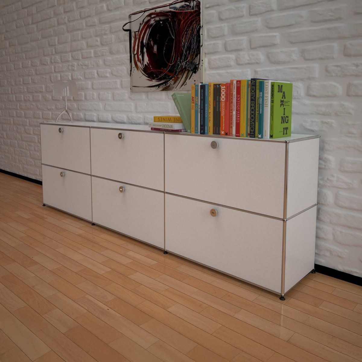 Das Bild zeigt USM Haller sideboard in weiß mit Büchern darauf im Wohnzimmer