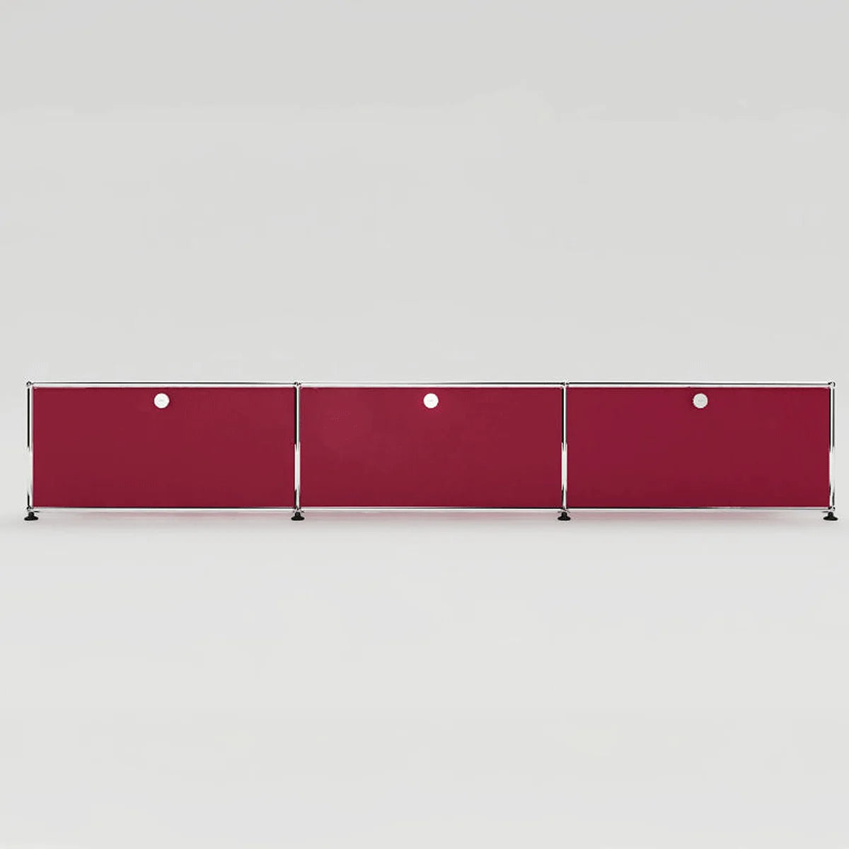 USM Haller Lowboard in Rubinrot, elegante Metallflächen mit kontrastierendem Chromrahmen