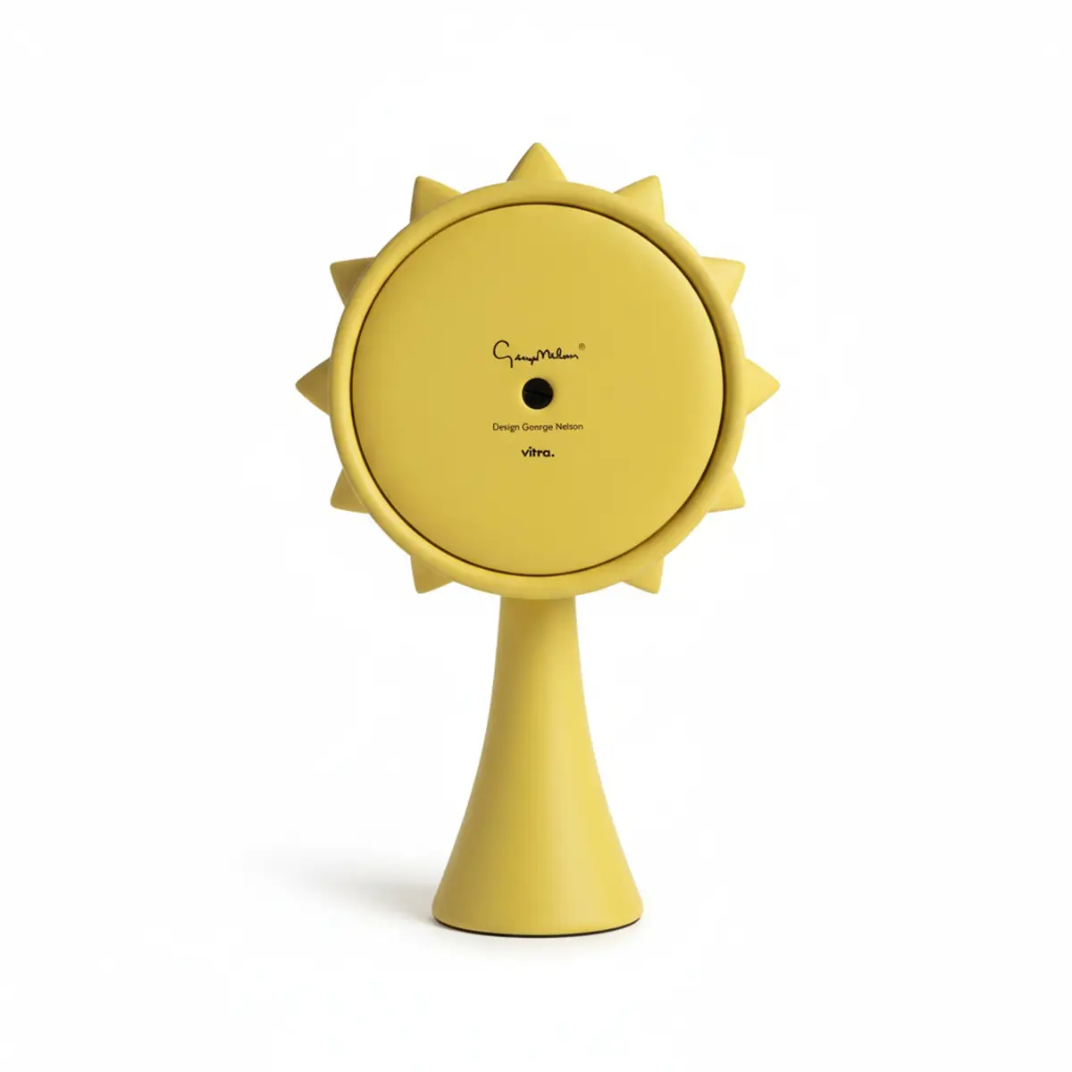Rueckansicht der Vitra Ceramic Clock Model in Gelb von George Nelson mit glatter Keramikflaeche und Uhrwerkabdeckung
